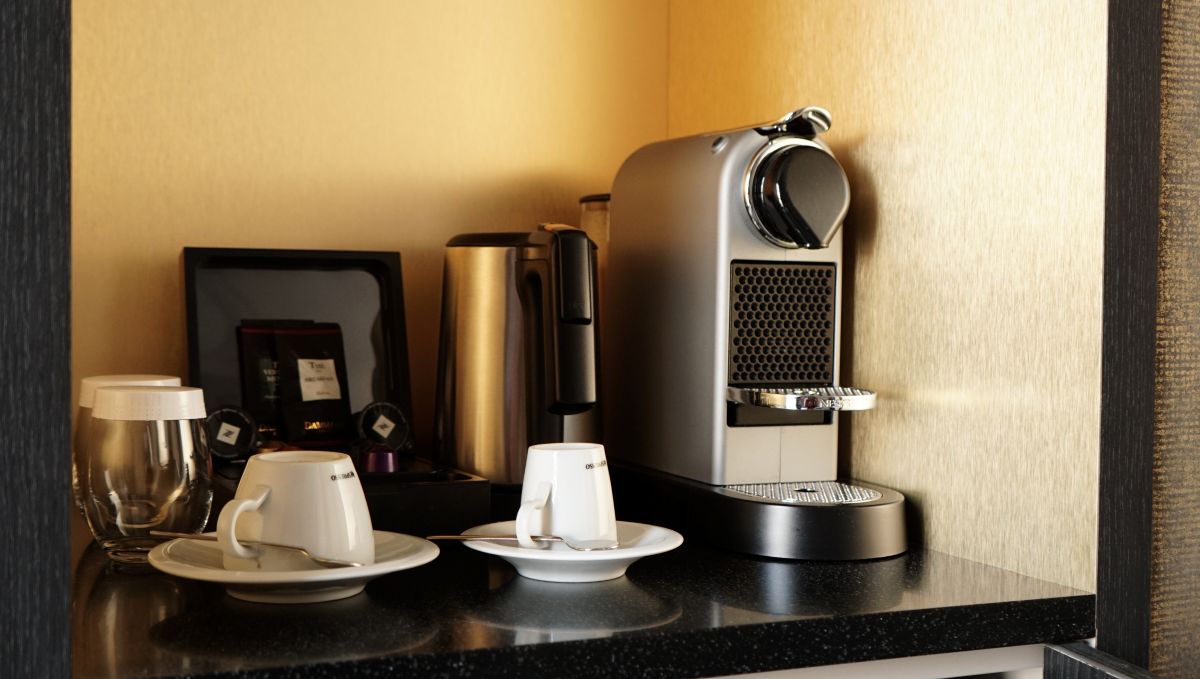 A close-up look at the coffee corner, including a Nespresso, available at the Niepce Paris Hotel in Paris, France.
