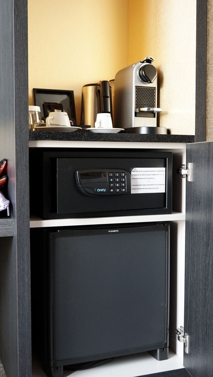 Fridge, safe box, and coffee corner available at the Niepce Paris Hotel in Paris, France.