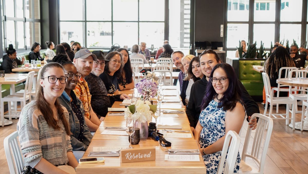 Yasmin's graduation party guests sitting at a table at True Food Kitchen.